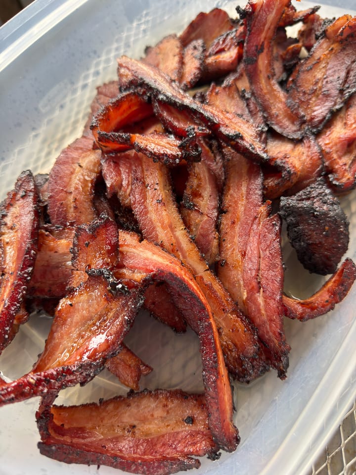 Fried and sliced bacon looking delicious.